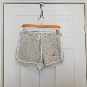 HOLLISTER GREY W/ PINK CURVED HEM SHORTS